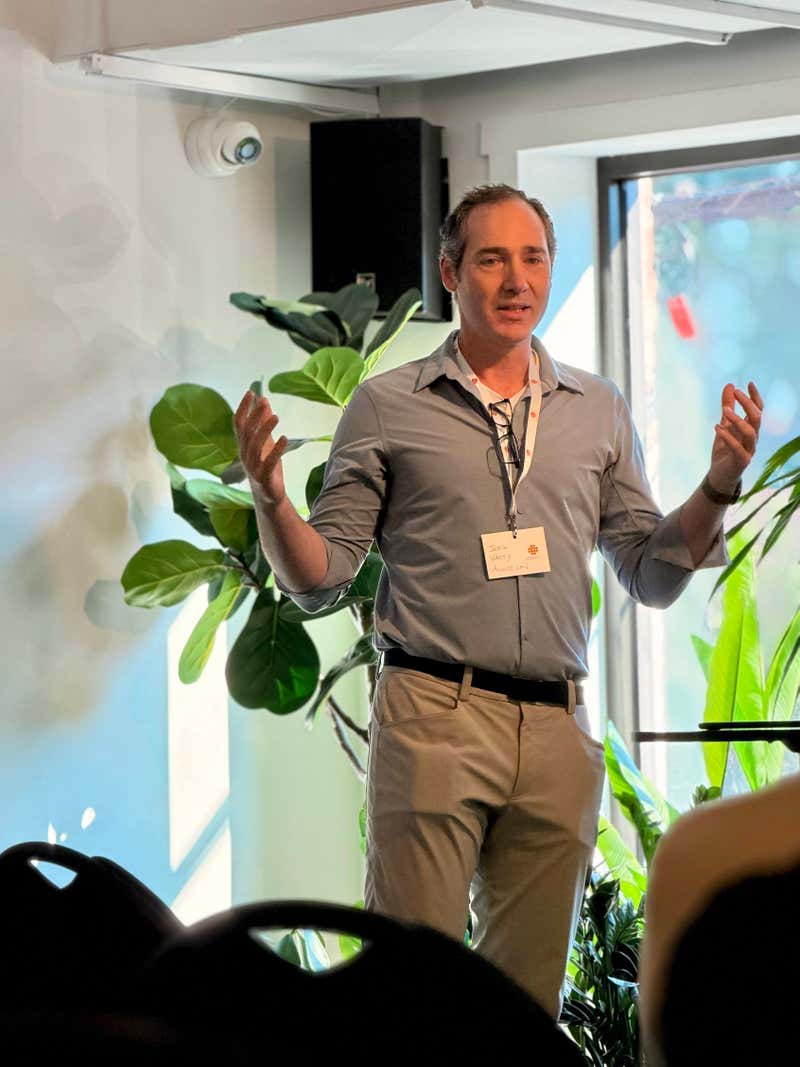 Joel Varty of Agility CMS presents at CMS Idol wearing a CMS Connect 2026 name badge
