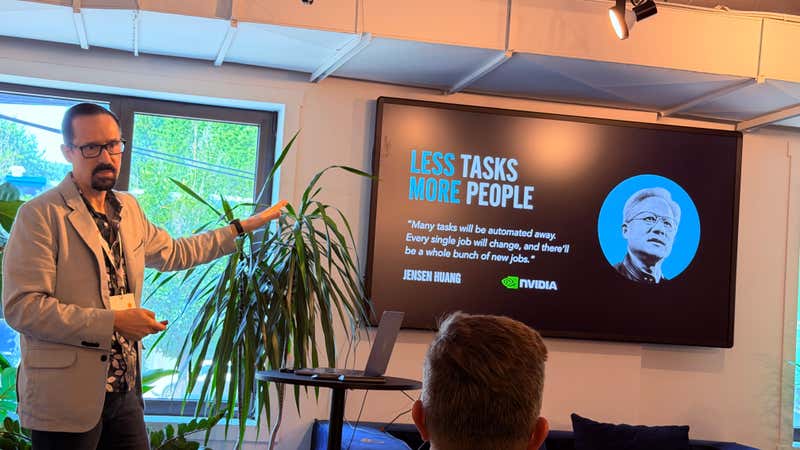 Slide reading Less Tasks More People quoting NVIDIA chief executive Jensen Huang on how automation changes jobs