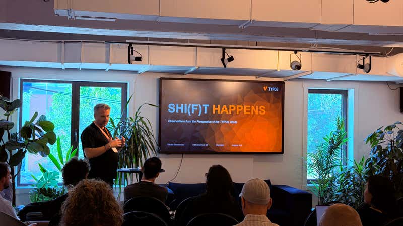 Olivier Dobberkau presents the TYPO3 title slide reading SHIFT HAPPENS at CMS Connect 2026