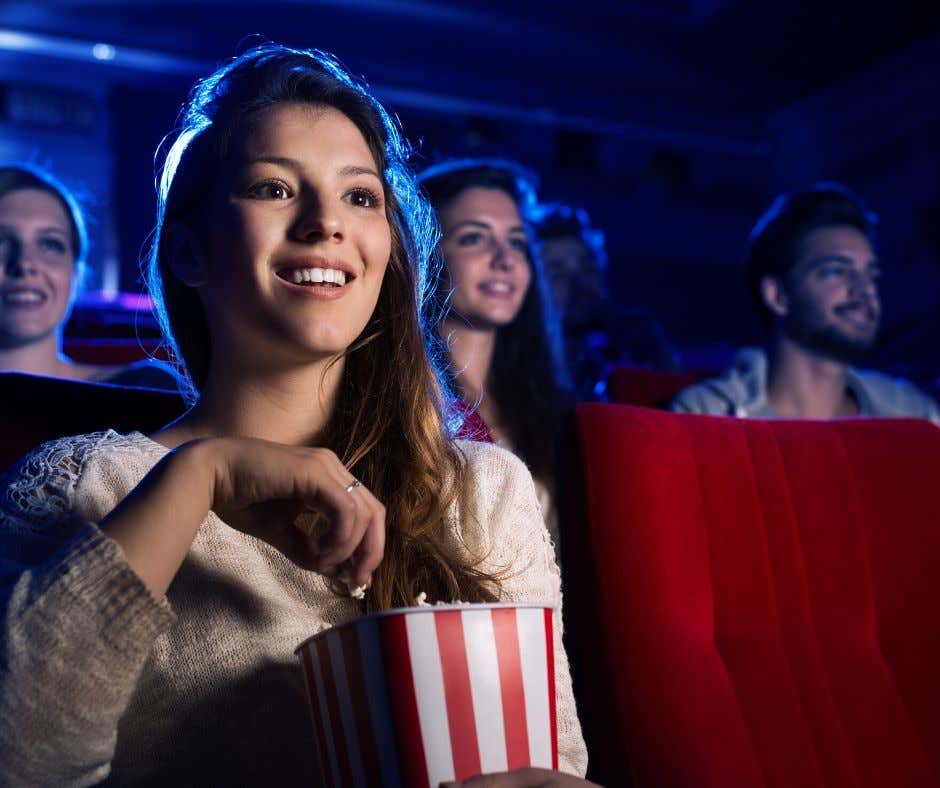 Woman at Cineplex watching movie on agilitycms.com