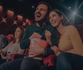 Woman at Cineplex watching movie on agilitycms.com