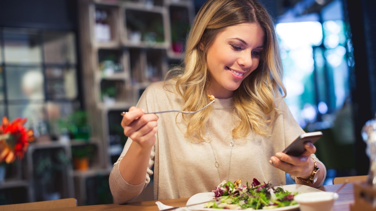 Woman posting food on social media on agilitycms.com