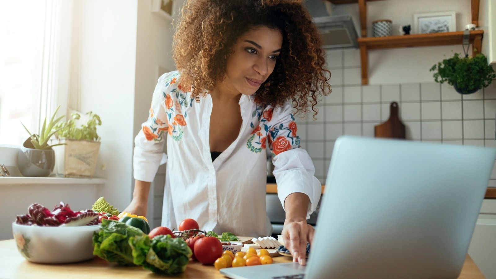 Woman using CMS for blog on agilitycms.com