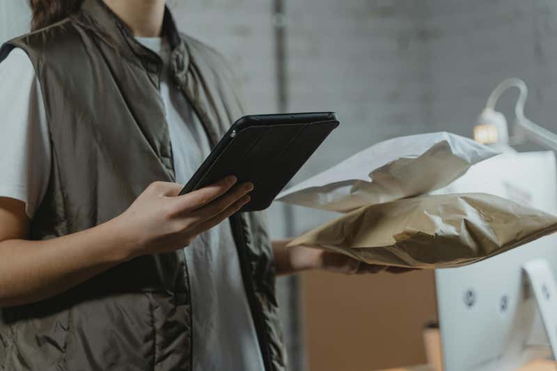 Photo of a person getting a package from an online order
