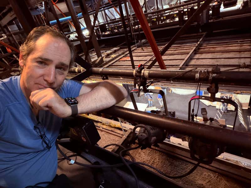 Joel Varty hanging lights at the Capitol Theatre in Port Hope