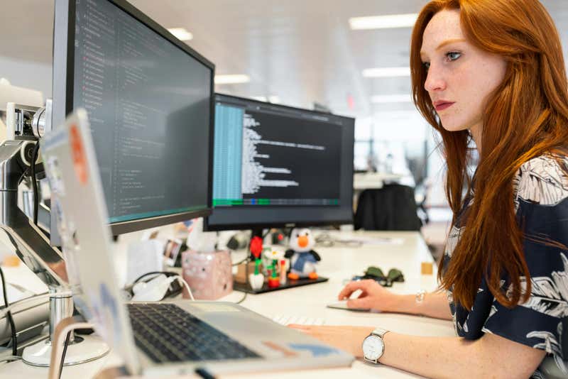 A developer coding at her terminal